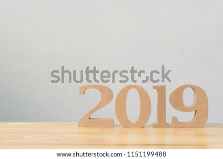 New years resolution 2019 concept. Wooden year number on table with copy space for your text