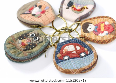 Quilting product. Key ring home pattern of quilt. Homemade Japanese quilt. Japanese handcraft on white background. Signed property release. Selective focus and free space for text,Design idea concept.