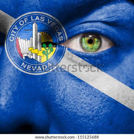 Flag painted on face with green eye to show Las Vegas support