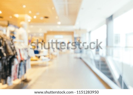 Abstract blur bokeh and defocused shopping mall of department store interior for background
