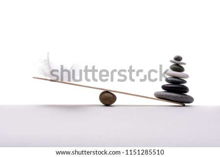 Spa stones isolated on white background. Concept of heavy and light.
 Royalty-Free Stock Photo #1151285510