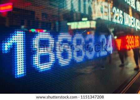 stock market numbers and city light reflection