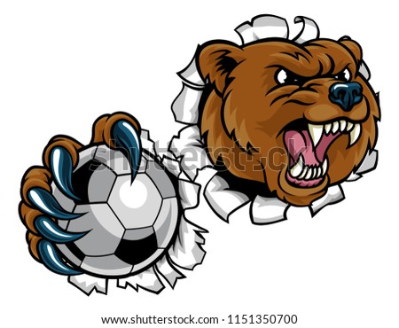 A bear angry animal sports mascot holding a soccer football ball and breaking through the background with its claws