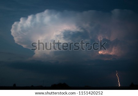 Spring Storm and lightning. Lightning is a sudden electrostatic discharge that occurs typically during a thunderstorm. 