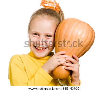 Cheerful girl hugs a pumpkin on a white background.