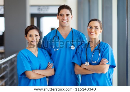 group of young hospital workers in scrubs
