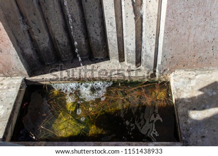 water pouring out from marble water tap. photo has taken from izmir/turkey.