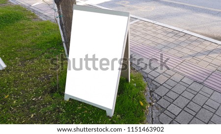 City Urban Outdoor White Blank Advertisement Banner Billboard Sign Mock Up With White Frame Standing On The Grass .Isolated Template Clipping Path