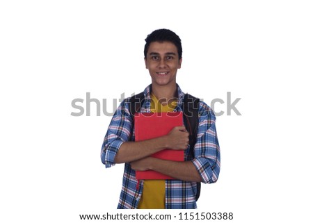 Young student holds red book to his chest hug it, isolated on a white background.