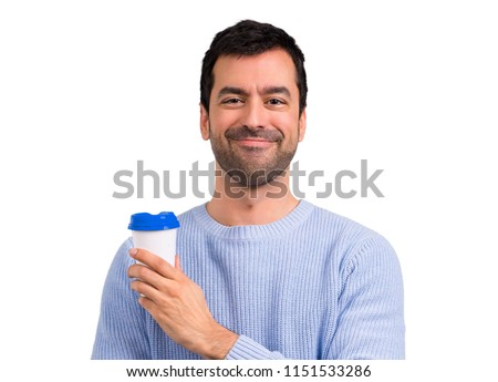 Man with blue sweater holding hot coffee in takeaway paper cup