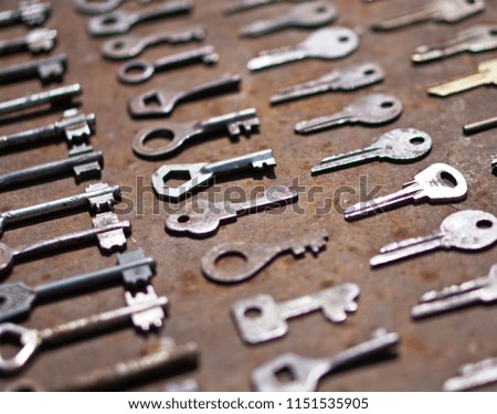Collection of a variety of old keys. Secret, On a metallic rusty grunge background. Creative decorative background for design. Retro style