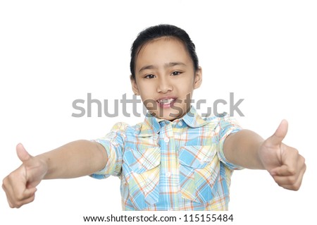 Pretty little girl showing thumbs up against white background