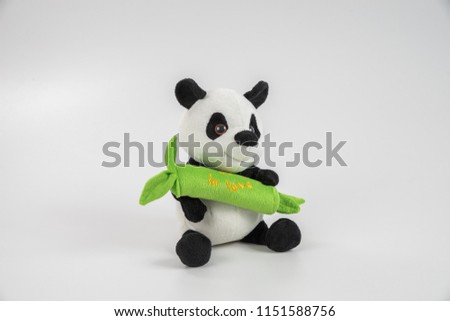 Soft toy for children on a white background. Bear cub. Panda.