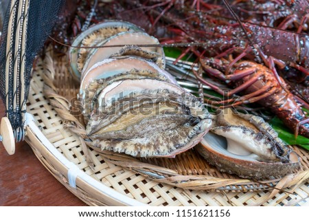 Fresh large abalones  , popular items in high-class Japanese cuisine , prepared for barbecue fire grill in Mie , Japan Royalty-Free Stock Photo #1151621156