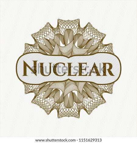 Brown rosette or money style emblem with text Nuclear inside