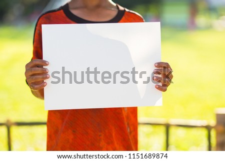 Kid holding white card,asian boy showing white empty card.