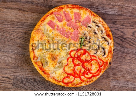 Tasty Pizza assortie with sausages, mushrooms and vegetables Royalty-Free Stock Photo #1151728031
