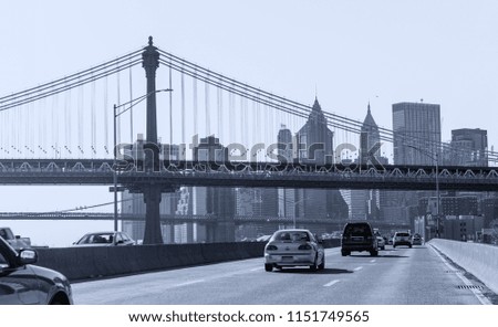 Brooklyn Bridge road and city skyline, New York City.