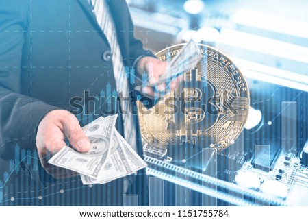 Businessmen hold dollars.Gold Bitcoin with electronic computer processor board.Digital money Digital currency Trading and investment concept.