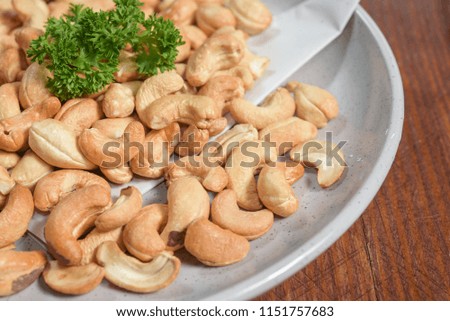 Cashew nuts hot baked on wooden table