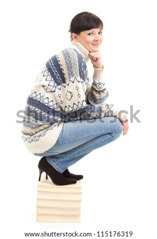 winter young woman with stack of books, white background