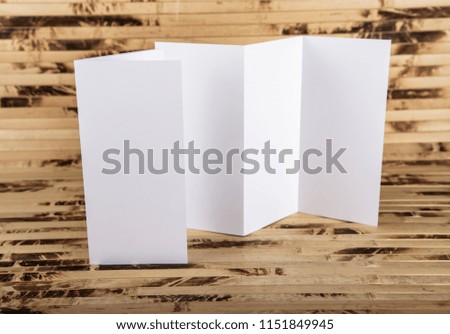 Mockup of white booklet on bamboo background
