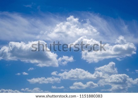 Cumulus clouds against the blue sky