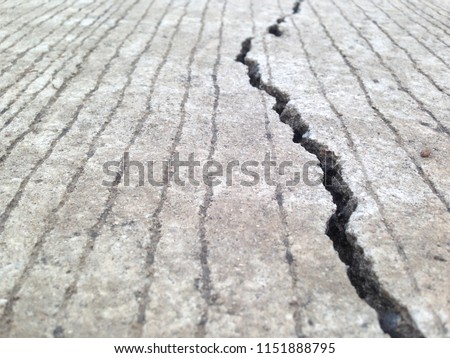 Cracks, crevices, concrete slabs this is caused by the non-standard construction. Crack of the road. Royalty-Free Stock Photo #1151888795