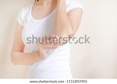 Woman applying elbow cream,lotion , Hygiene skin body care concept. Royalty-Free Stock Photo #1151892905