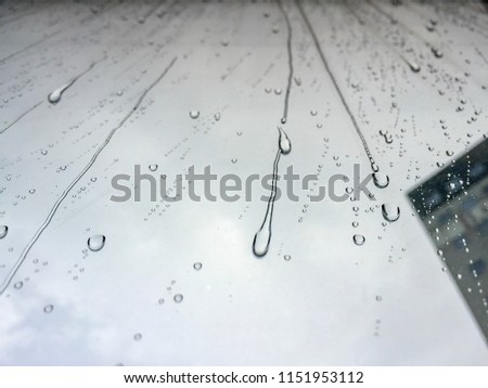 Rain drop window rainy season rainy window. Rainwater droplets flow down the glass.