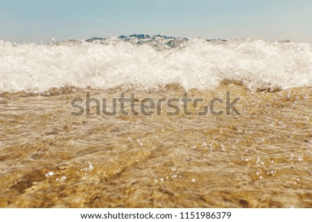 Wave of blue ocean on sandy beach Summer Background