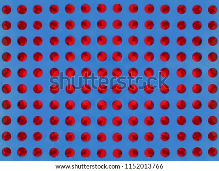 Blue colour and red seamless dot holes pattern background in the form of a colour plastic sheet