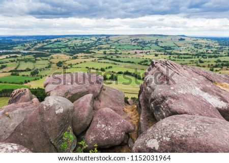 Rock formations at the Roaches, Peak District National park with the view of the stones and fields on the background, selective focus