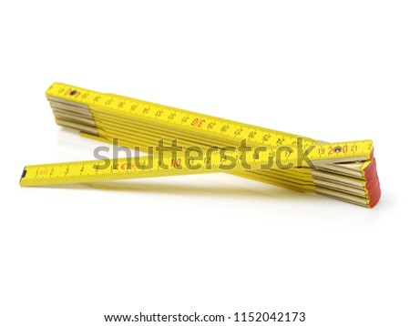 Wooden folding ruler on white background Royalty-Free Stock Photo #1152042173
