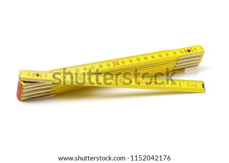 Wooden folding ruler on white background Royalty-Free Stock Photo #1152042176