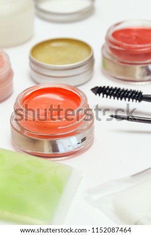 Cream eyeshadow, lip stain or blush in the jars at make up artist table