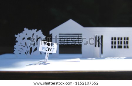 House made of paper for rent. Paper art. House white paper cut concept