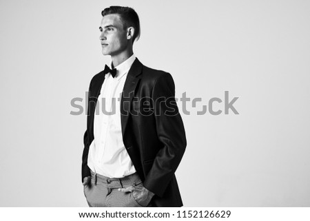 dash picture of a gentleman with a bow tie and in a classic suit                              