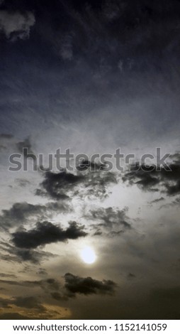 the sun among the clouds