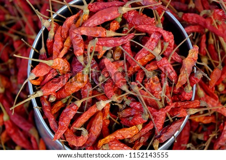 Dried red chili or chilli cayenne pepper. Food background. Royalty-Free Stock Photo #1152143555