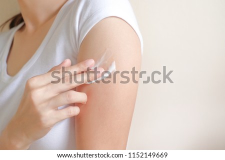 Woman applying arm cream,lotion , Hygiene skin body care concept. Royalty-Free Stock Photo #1152149669
