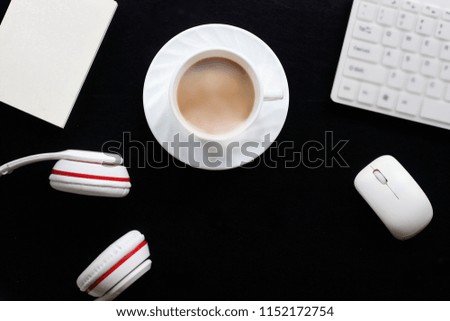 Top view Coffee cup and Earphone on black wood table