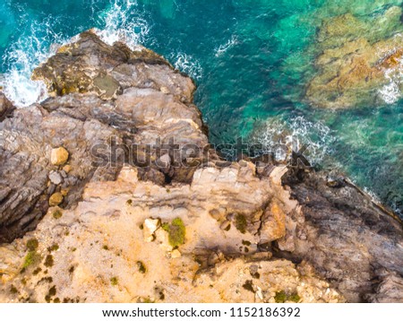 Spanish rocks of Cabo de Palos, volcanic mounts that form a small peninsula, drone arial shoot. Summer 2018