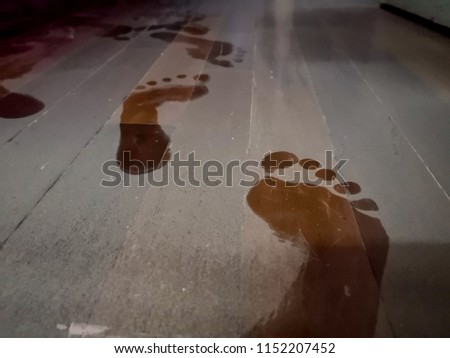 Footprint on dirty floor,dust on the floor