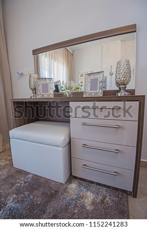 Interior design decor furnishing of luxury show home bedroom with dressing table vanity unit