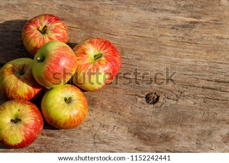 Fresh ripe apples on rustic wooden table. Top view, copy space