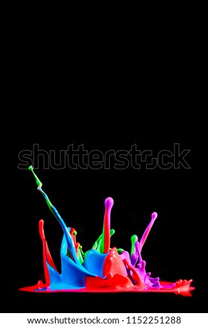 Dancing colored paint. Abstract sculpture dye. Splash of ink on a black background