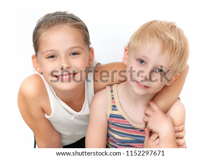 brother with sister on a light background