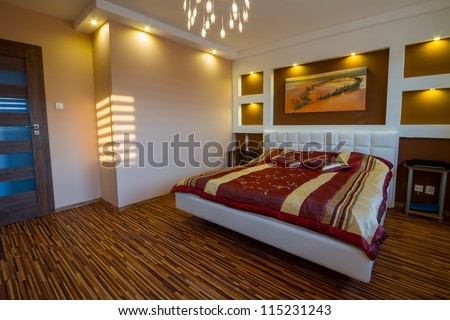 Modern master bedroom interior with picture of shipwreck on the wall (photo coming from my gallery)