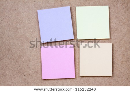 Color note paper on textured background